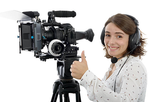 istock beautiful young woman with DSLR video camera 626571850