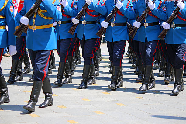 istock Guard soldiers marching with rifles 626572798