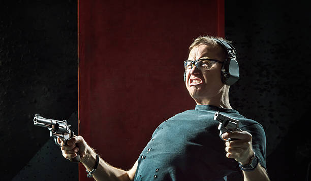 istock Mad man with a gun in his hand 626575050