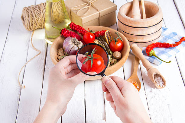 istock Vegetables spices tomatoes hand research magnifying glass 626575382