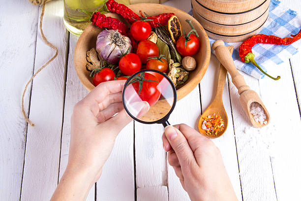 istock Vegetables spices tomatoes hand research magnifying glass 626575696