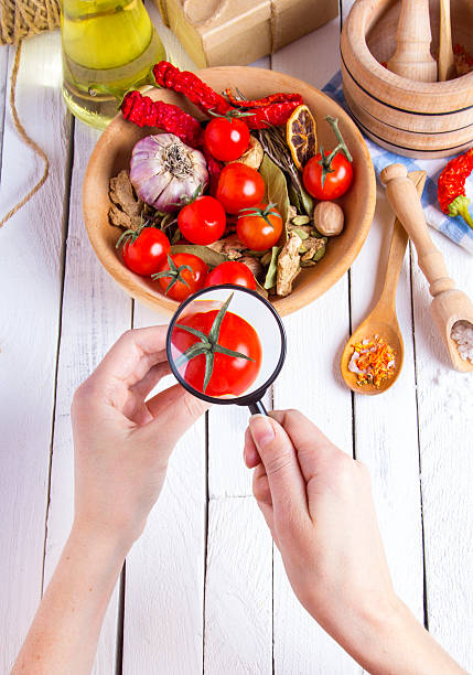 istock Vegetables spices tomatoes hand research magnifying glass 626575770