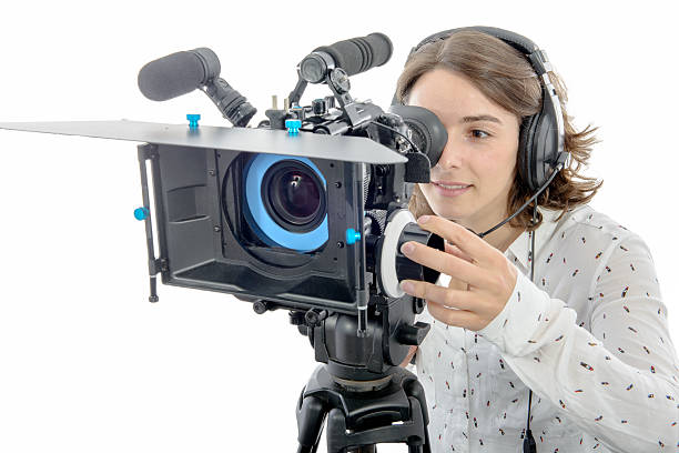 istock beautiful young woman with DSLR video camera 626576286
