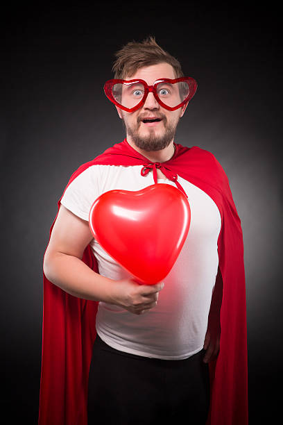 istock Super hero man in love 626576374