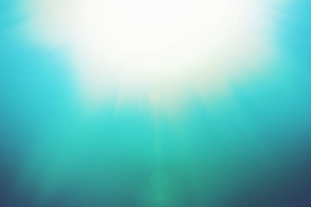 istock Noonday sun centered on turquoise sky makes abstract natural background 626576626