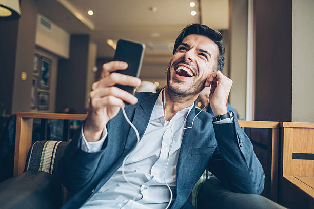istock Happy businessman with smart phone 626583114