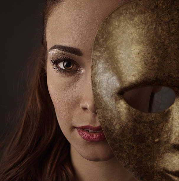 istock Beautiful woman with a old carnival mask 626584102