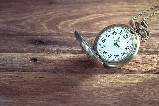 istock Pocket watch on wooden background 626584488