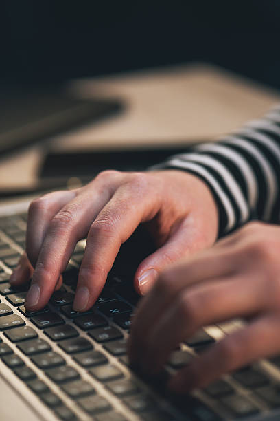 istock Female blogger typing blog post on laptop computer 626585384