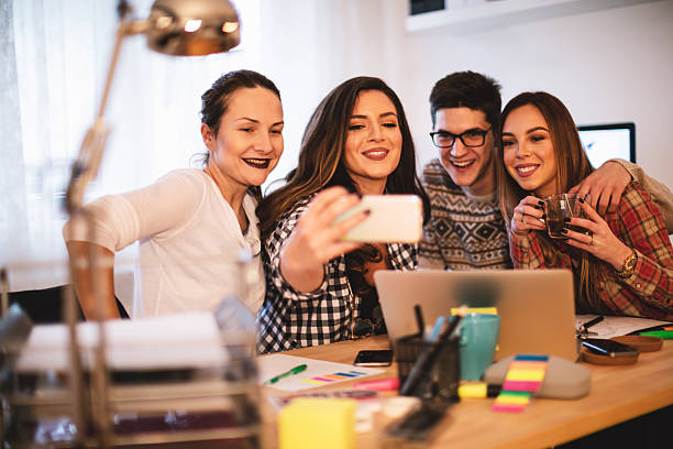istock Colleagues taking selfie with mobile phone 626585470