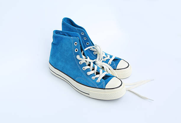istock Pair of new blue sneakers isolated on white background 626586466
