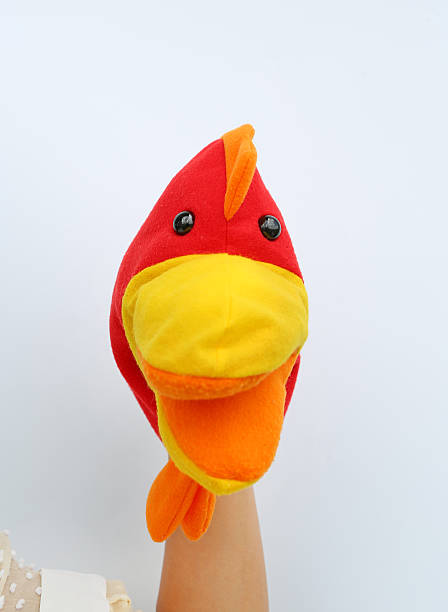 istock hand wearing children puppets, Chicken head 626587420