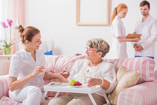 istock Nurse giving medicines in private clinic 626588058