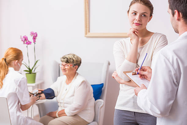 istock Doctor talking with patient's daughter 626588102