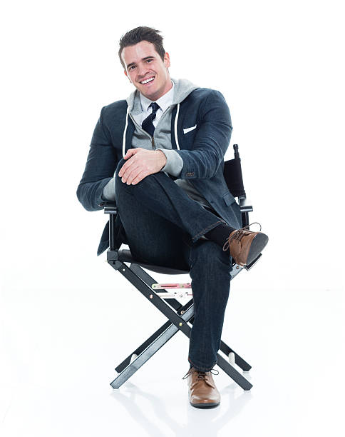 istock Smiling man sitting on chair 626589144