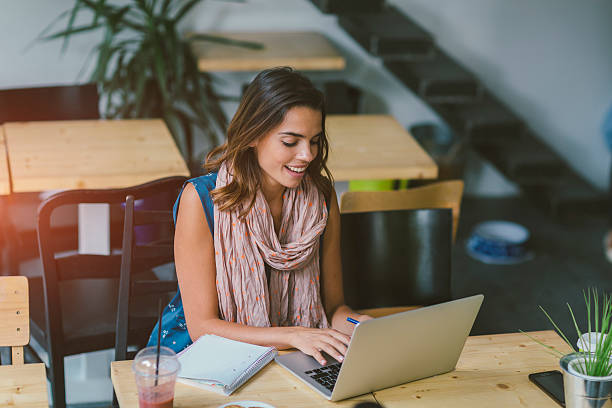 istock Smiling Woman Working In Her Cafe 626590760