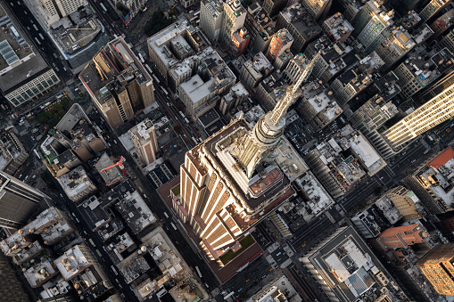 Helicopter point of view of Empire State Building in New York with many details visible in the image.