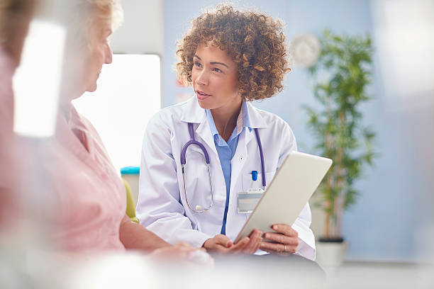 istock concerned female doctor with digital tablet . 626592488