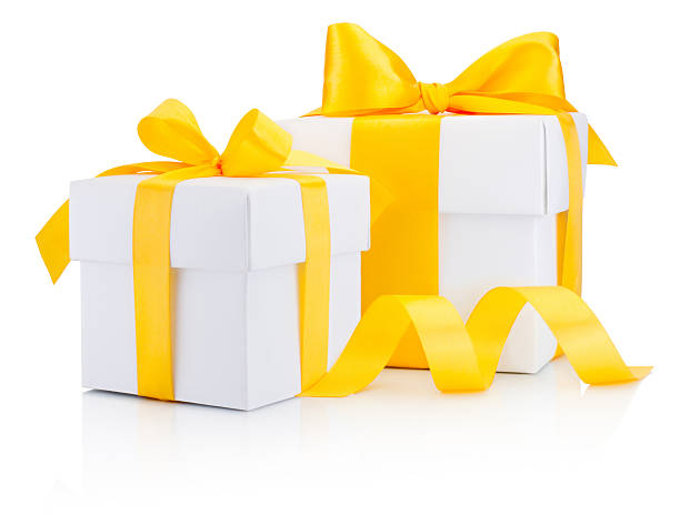 istock Two white gift boxes tied yellow ribbon bow Isolated 626602778