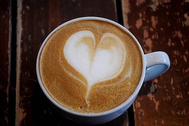 istock Coffee in cup on wooden table for background 626603354