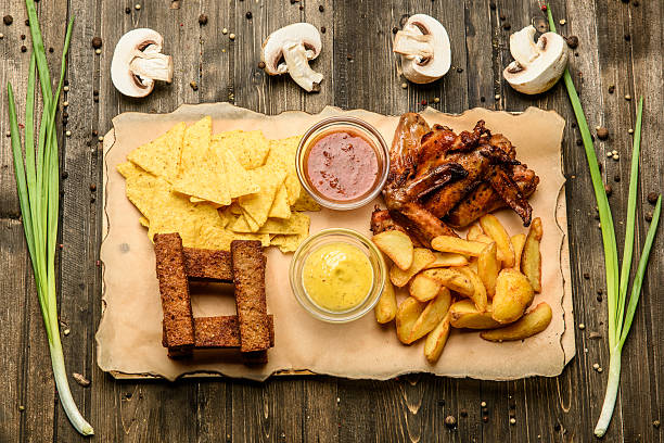 istock wide selection of snacks for beer on parchment top view 626605786