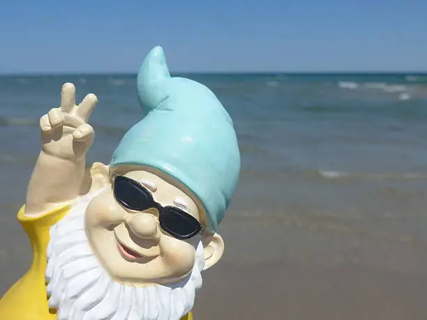 Photo of Garden gnome on vacation at sea