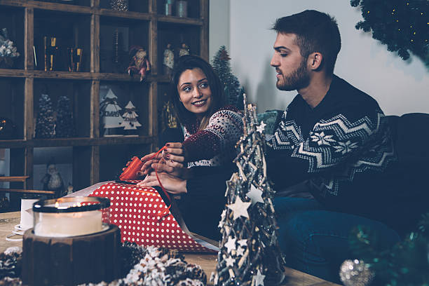 istock Couple wrapping Christmas presents 626608886