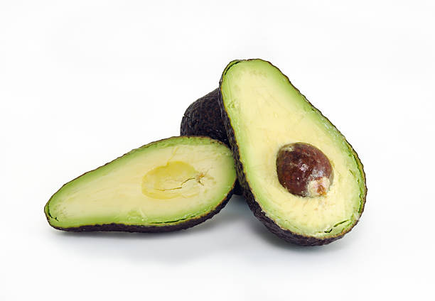 avocado fruit isolated on white background - persea imagens e fotografias de stock