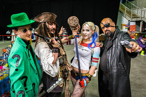 Group of cosplayers at Yorkshire Cosplay Convention Sheffield, United Kingdom - June 12, 2016: Cosplayers dressed as 'The Riddler', 'Captain Jack Sparrow', 'Harley Quinn' and 'Nick Fury' at the Yorkshire Cosplay Convention at Sheffield Arena cosplay stock pictures, royalty-free photos & images