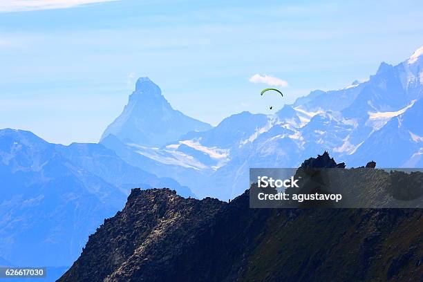 Freedom Paragliding Above Matterhorn And Weisshorn Alpine Massif Swiss Alps Stock Photo - Download Image Now