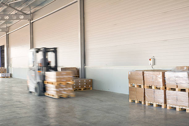 istock Forklift carrying cardboard box in warehouse. 626617790