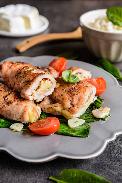istock Roasted turkey breasts stuffed with Camembert, served with rice 626618006