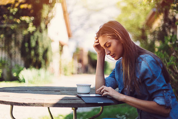 Woman reading book among nature
