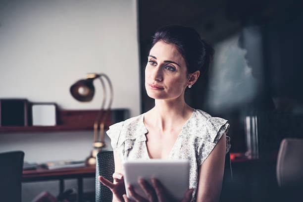 istock Businesswoman holding digital tablet in office 626619164