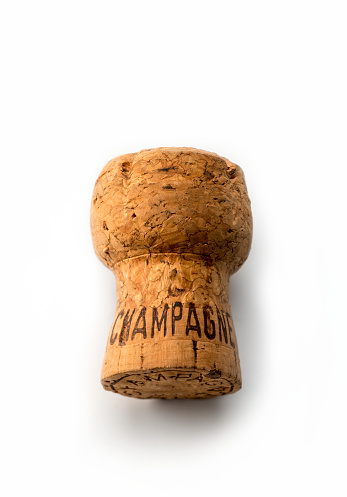 Champagne cork on white background