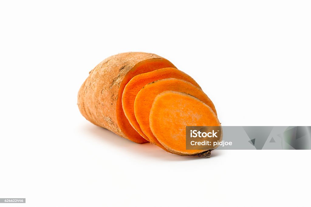 Sweet potato isolated on white studio background one sweet potato, half sliced up. Sweet Potato Stock Photo