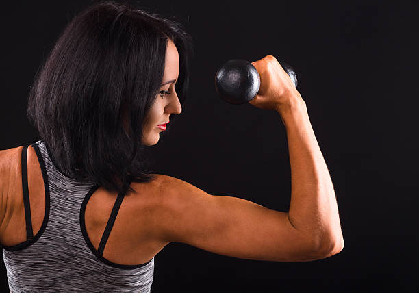 istock Fitness woman training with dumbbells 626624090