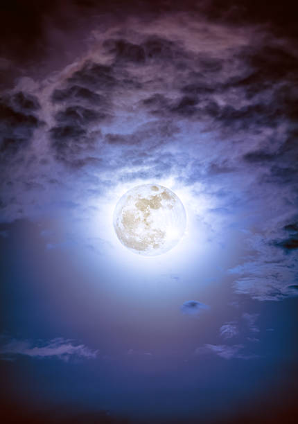 istock Nighttime sky with clouds and bright full moon with shiny. 626624788