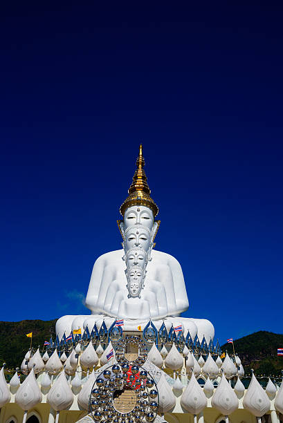 istock Big white buddha Phasornkaew temple in blue sky 626625950