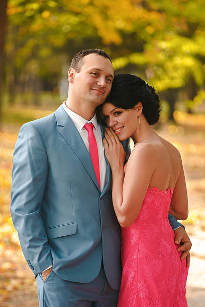istock Young bridegroom gentle hugs his beautiful bride. 626626234