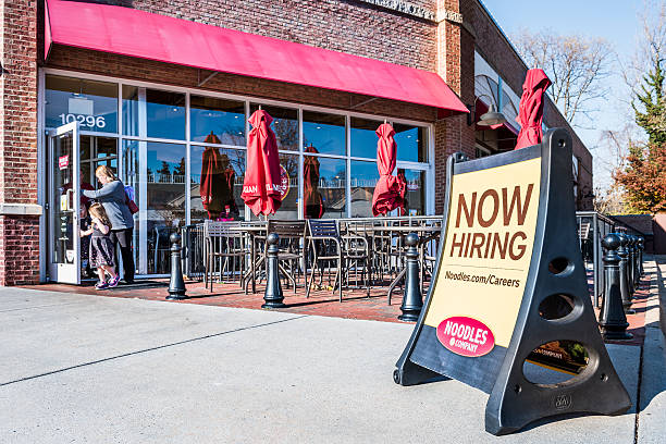 Noodles & Company World Kitchen outdoor seating area Fairfax, USA - November 27, 2016: Noodles & Company World Kitchen outdoor seating area with Now Hiring sign fairfax virginia photos stock pictures, royalty-free photos & images
