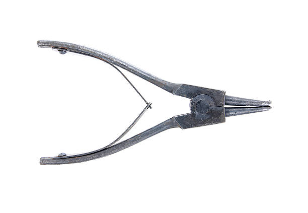 istock Old snap ring pliers isolated on white background. 626628486
