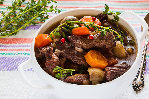 istock Beef Bourguignon in a white soup bowl. Stew with carrots, 626628556