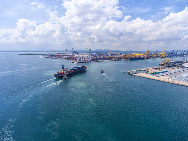 istock container ship in import export and business logistic.By crane , 626628672