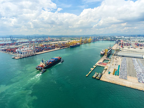 istock container ship in import export and business logistic.By crane , 626628868