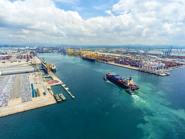 istock container ship in import export and business logistic.By crane , 626629126