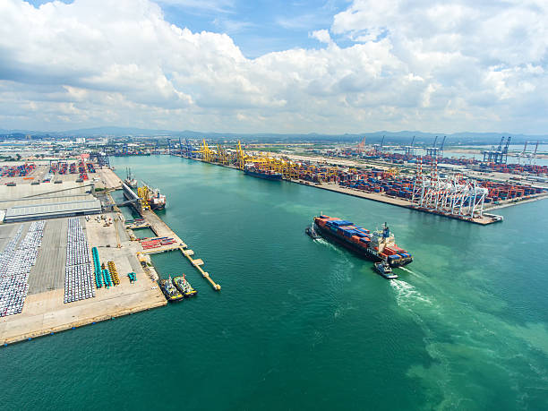 istock container ship in import export and business logistic.By crane , 626629280