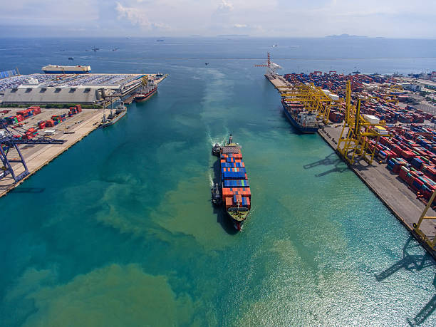 istock container ship in import export and business logistic.By crane , 626629564