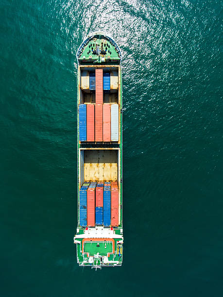istock container ship in import export and business logistic.By crane , 626630936