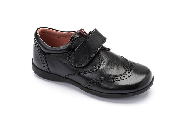 istock Boys black school shoe on a white background 626631034